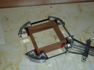 I used my new framing clamp to hold the sides together while gluing